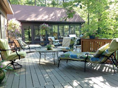 Expansive deck and garden by the pond