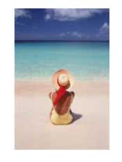 woman in a sun hat sitting on a Caribbean beac