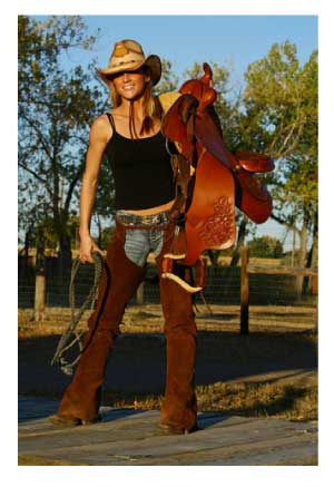 cowgirl with saddle and chaps