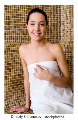 woman at a spa wrapped in a towe